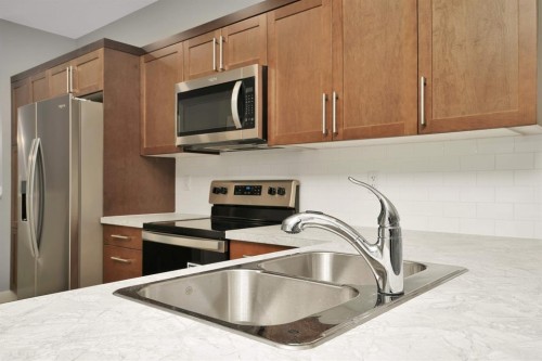 112 Hinshaw Drive, Sylvan Lake, AB - Indoor Photo Showing Kitchen With Double Sink