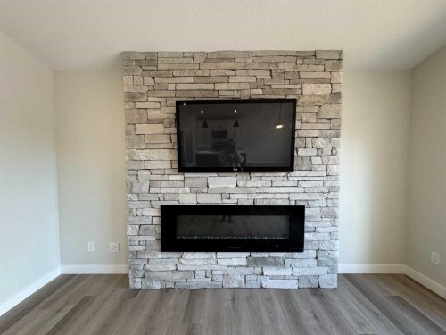 4237 Westbrooke Road, Blackfalds, AB - Indoor Photo Showing Living Room With Fireplace