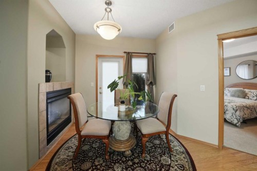 111-5300 48 Street, Red Deer, AB - Indoor Photo Showing Dining Room With Fireplace