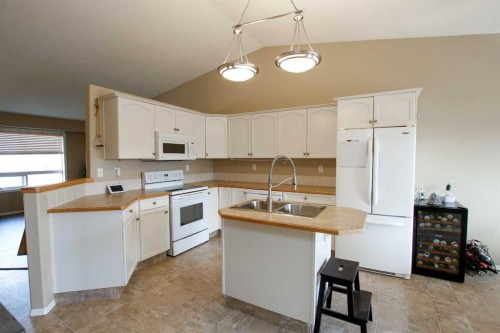13 Kenny Close, Red Deer, AB - Indoor Photo Showing Kitchen With Double Sink