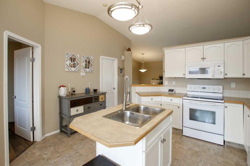 13 Kenny Close, Red Deer, AB - Indoor Photo Showing Kitchen With Double Sink