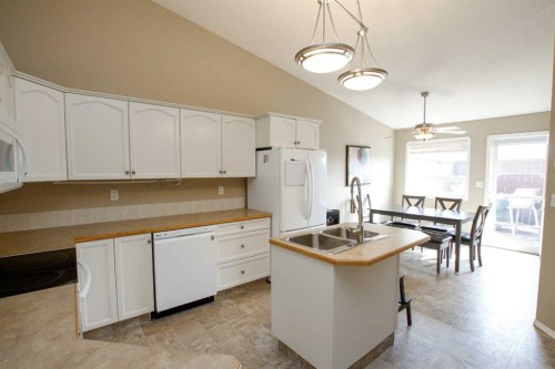 13 Kenny Close, Red Deer, AB - Indoor Photo Showing Kitchen With Double Sink