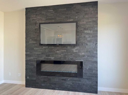 53 Emmett Crescent, Red Deer, AB - Indoor Photo Showing Living Room With Fireplace