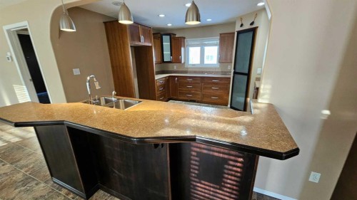5112 52 Avenue, Consort, AB - Indoor Photo Showing Kitchen With Double Sink