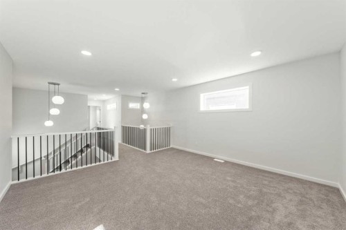 8 Heritage Link, Cochrane, AB - Indoor Photo Showing Other Room