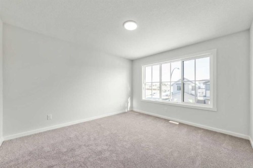 8 Heritage Link, Cochrane, AB - Indoor Photo Showing Other Room