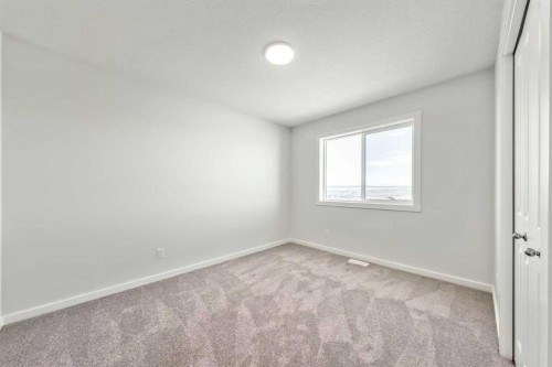 8 Heritage Link, Cochrane, AB - Indoor Photo Showing Other Room