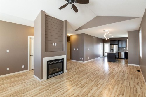 6321 58 Avenue, Innisfail, AB - Indoor Photo Showing Living Room With Fireplace