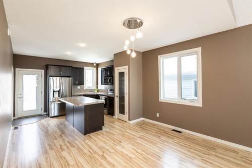 6321 58 Avenue, Innisfail, AB - Indoor Photo Showing Kitchen With Stainless Steel Kitchen