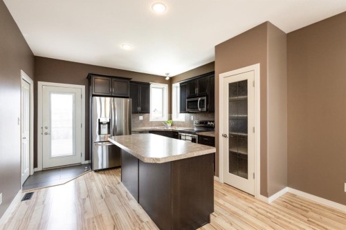 6321 58 Avenue, Innisfail, AB - Indoor Photo Showing Kitchen With Stainless Steel Kitchen With Double Sink