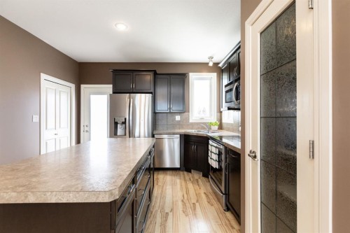 6321 58 Avenue, Innisfail, AB - Indoor Photo Showing Kitchen With Stainless Steel Kitchen