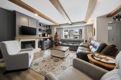 3722 44 Avenue, Red Deer, AB - Indoor Photo Showing Living Room With Fireplace