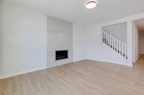 613 Sailfin Drive, Rural Rocky View County, AB - Indoor With Fireplace