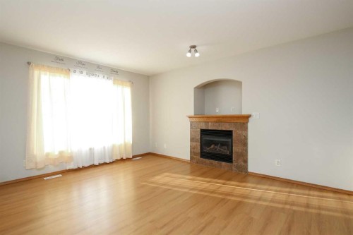 72 Ironstone Drive, Red Deer, AB - Indoor Photo Showing Living Room With Fireplace