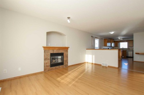 72 Ironstone Drive, Red Deer, AB - Indoor Photo Showing Living Room With Fireplace