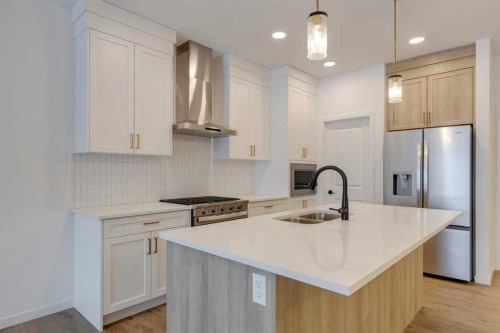 1402 Bayview Crescent Sw, Airdrie, AB - Indoor Photo Showing Kitchen With Double Sink With Upgraded Kitchen