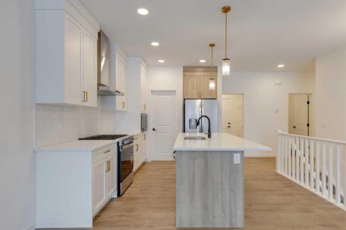 1402 Bayview Crescent Sw, Airdrie, AB - Indoor Photo Showing Kitchen With Upgraded Kitchen