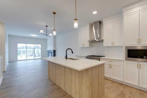 1402 Bayview Crescent Sw, Airdrie, AB - Indoor Photo Showing Kitchen With Double Sink With Upgraded Kitchen