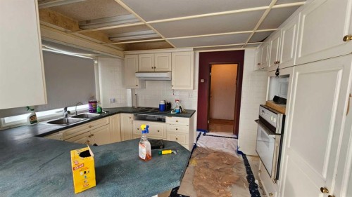 5006 Alexander Avenue, Coronation, AB - Indoor Photo Showing Kitchen With Double Sink
