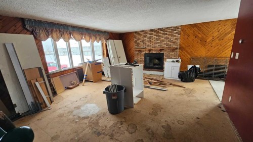 5006 Alexander Avenue, Coronation, AB - Indoor With Fireplace