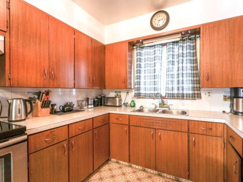 4716 51 Street, Stettler, AB - Indoor Photo Showing Kitchen With Double Sink
