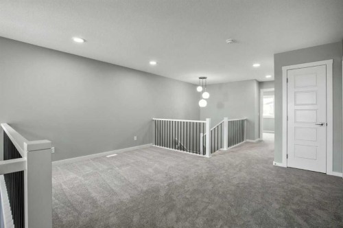 11 Heritage Link, Cochrane, AB - Indoor Photo Showing Other Room