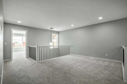 11 Heritage Link, Cochrane, AB - Indoor Photo Showing Other Room