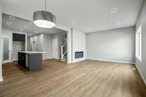 11 Heritage Link, Cochrane, AB - Indoor With Fireplace