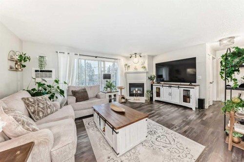 314-5326 47 Avenue, Red Deer, AB - Indoor Photo Showing Living Room With Fireplace