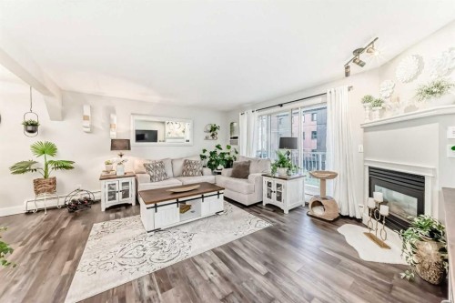 314-5326 47 Avenue, Red Deer, AB - Indoor Photo Showing Living Room With Fireplace