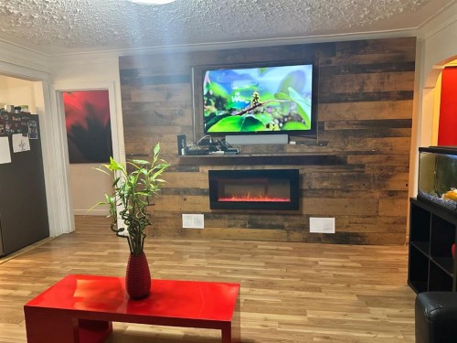 5302 50 Street, Camrose, AB - Indoor Photo Showing Other Room With Fireplace