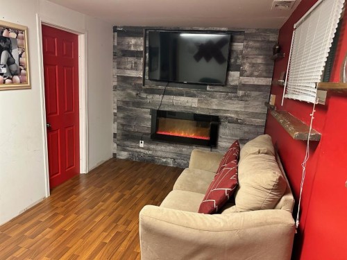 5302 50 Street, Camrose, AB - Indoor Photo Showing Living Room With Fireplace