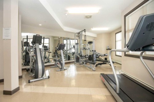 207-100 Lakeway Boulevard, Sylvan Lake, AB - Indoor Photo Showing Gym Room