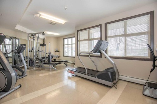 207-100 Lakeway Boulevard, Sylvan Lake, AB - Indoor Photo Showing Gym Room