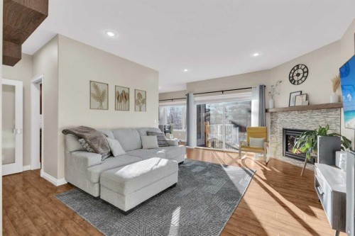 6372 Cedar Way, Innisfail, AB - Indoor Photo Showing Living Room With Fireplace