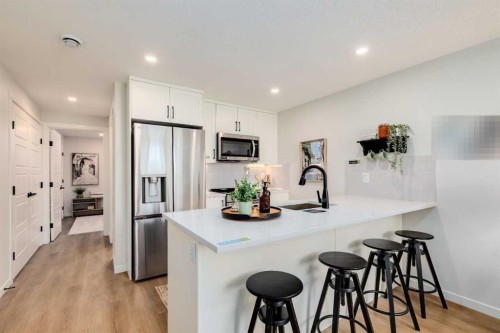 105-40 Livingston Parade Ne, Calgary, AB - Indoor Photo Showing Kitchen With Upgraded Kitchen