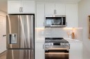 105-40 Livingston Parade Ne, Calgary, AB  - Indoor Photo Showing Kitchen With Upgraded Kitchen 