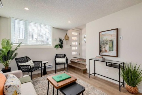 105-40 Livingston Parade Ne, Calgary, AB - Indoor Photo Showing Living Room