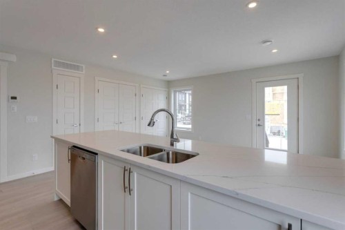 215-40 Livingston Parade Ne, Calgary, AB - Indoor Photo Showing Kitchen With Double Sink