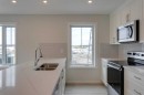 215-40 Livingston Parade Ne, Calgary, AB  - Indoor Photo Showing Kitchen With Double Sink 