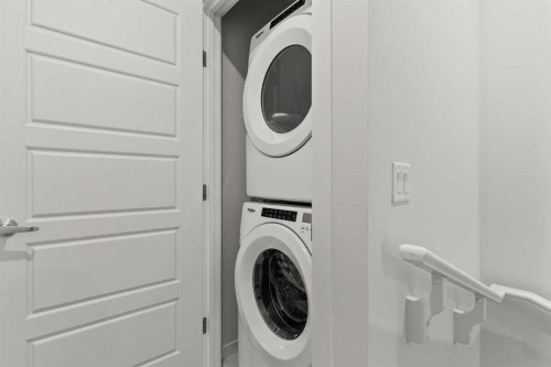 110-40 Livingston Parade Ne, Calgary, AB - Indoor Photo Showing Laundry Room