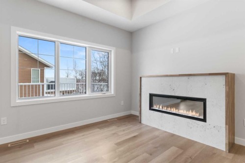 4922 Beardsley Avenue, Lacombe, AB - Indoor Photo Showing Living Room With Fireplace