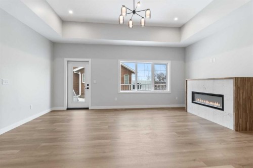 4924 Beardsley Avenue, Lacombe, AB - Indoor Photo Showing Other Room With Fireplace