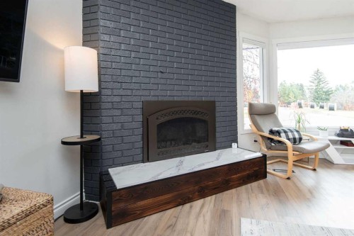 34 Wright Avenue, Red Deer, AB - Indoor Photo Showing Living Room With Fireplace