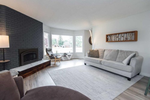 34 Wright Avenue, Red Deer, AB - Indoor Photo Showing Living Room With Fireplace