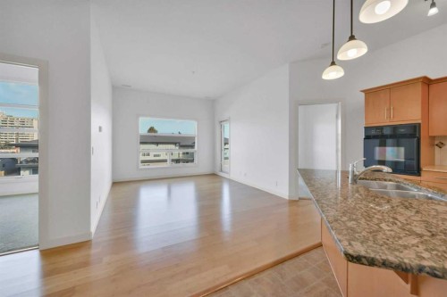 411-5110 36 Street, Red Deer, AB - Indoor Photo Showing Kitchen With Double Sink