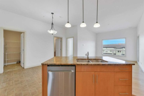 411-5110 36 Street, Red Deer, AB - Indoor Photo Showing Kitchen With Double Sink