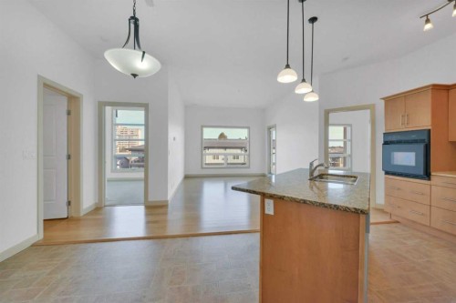 411-5110 36 Street, Red Deer, AB - Indoor Photo Showing Kitchen With Double Sink