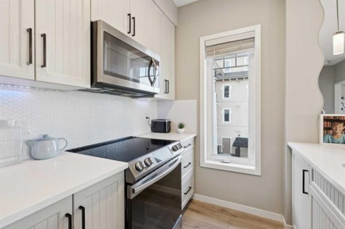 306-20 Mahogany Mews Se, Calgary, AB - Indoor Photo Showing Kitchen With Upgraded Kitchen