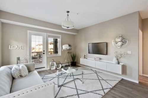 306-20 Mahogany Mews Se, Calgary, AB - Indoor Photo Showing Living Room